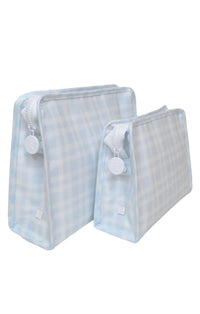 A blue and white plaid coated cotton pouch with a chunky white zipper and snap closure.