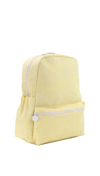 Yellow backpack with white zippers on a white background