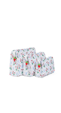 Set of three baby bags with strawberry pattern on a white background