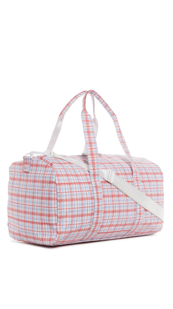Plaid duffel bag with white strap on a white background