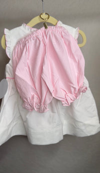 Pink bloomers hanging from a hanger