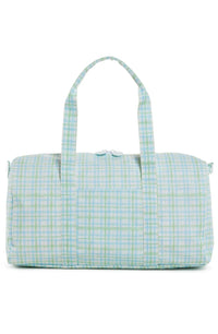 A green plaid duffel bag with handles and a zipper.
