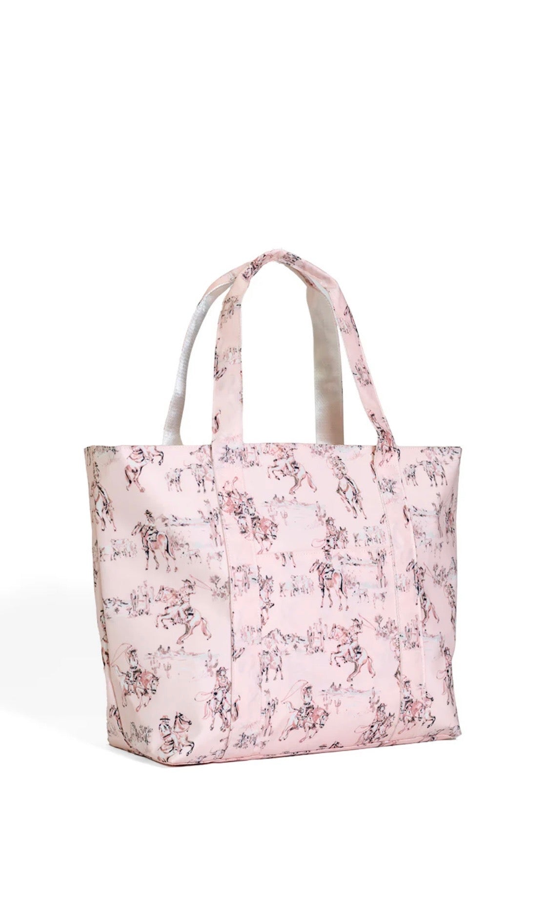 cowboy toile patterned tote bag on a white background