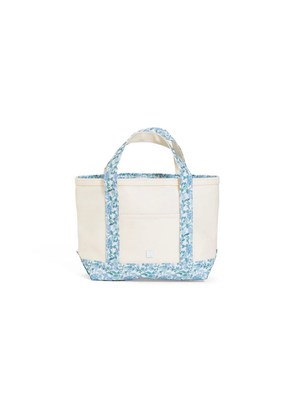White tote bag with blue floral pattern on a white background