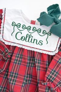 Red and green plaid bubble romper with white collar embroidered with a name and bow motif