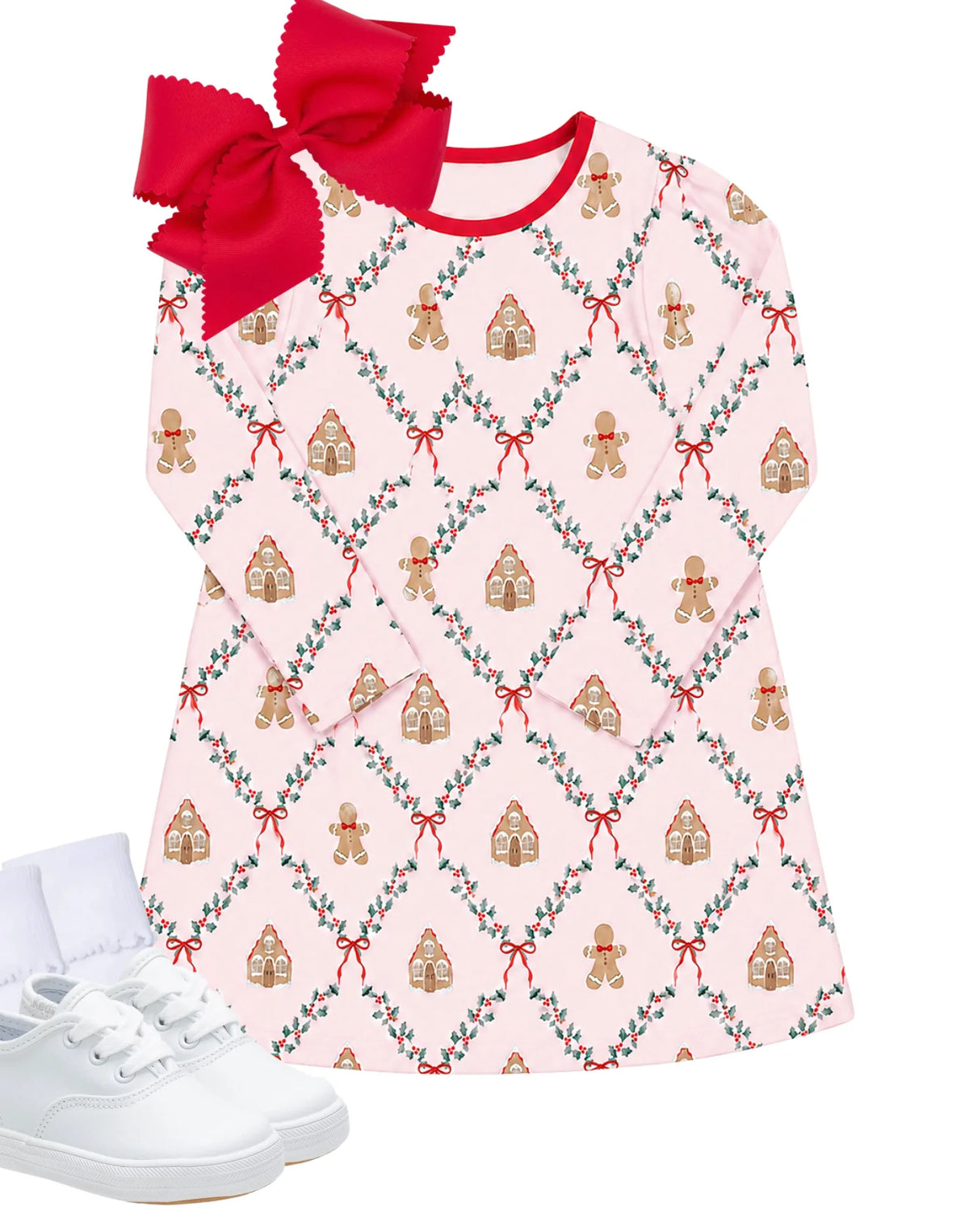 Pink knit dress with gingerbread house and wreath print, paired with a red bow