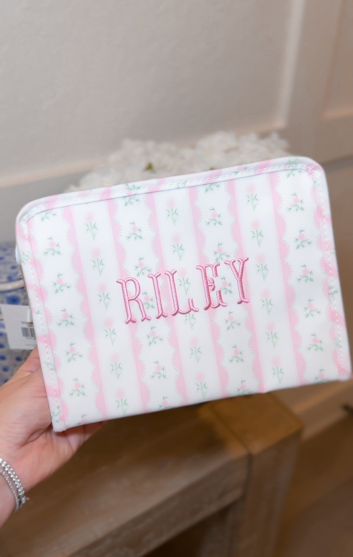 Pink ribbon floral roadie embroidered with the name Riley