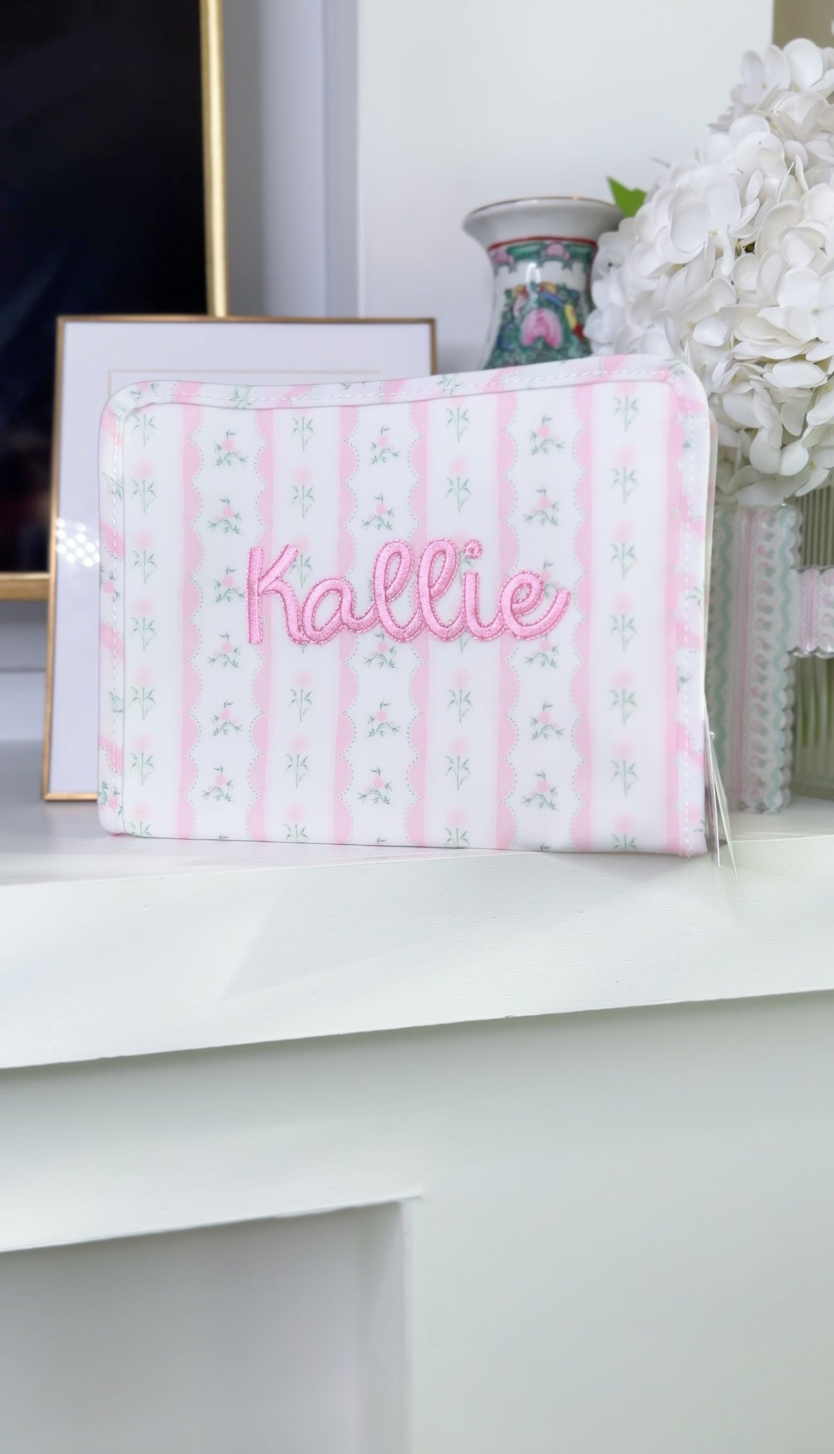 Pink ribbon floral roadie embroidered with the name Kallie
