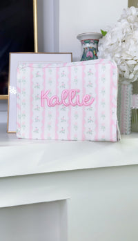 Pink ribbon floral roadie embroidered with the name Kallie