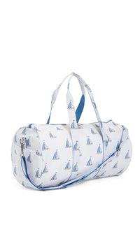 Duffle bag with sailboat pattern on a white background