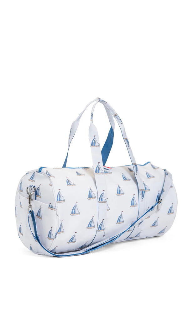 Duffle bag with sailboat pattern on a white background
