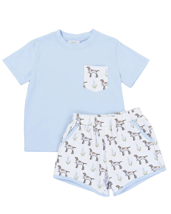 Light blue t-shirt with a dog pattern pocket and matching shorts on a white background