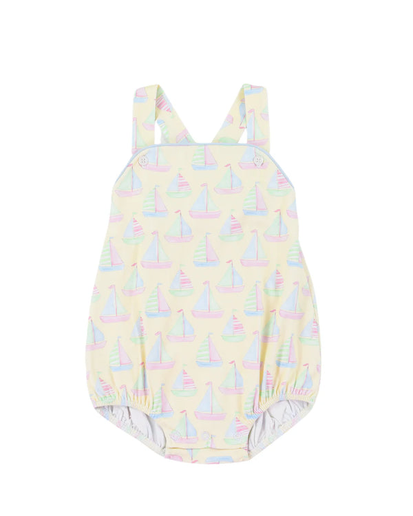 One piece sunsuit with sailboat pattern on a white background
