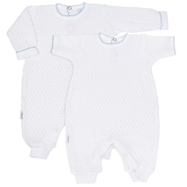 Two white baby rompers with blue trim on a white background