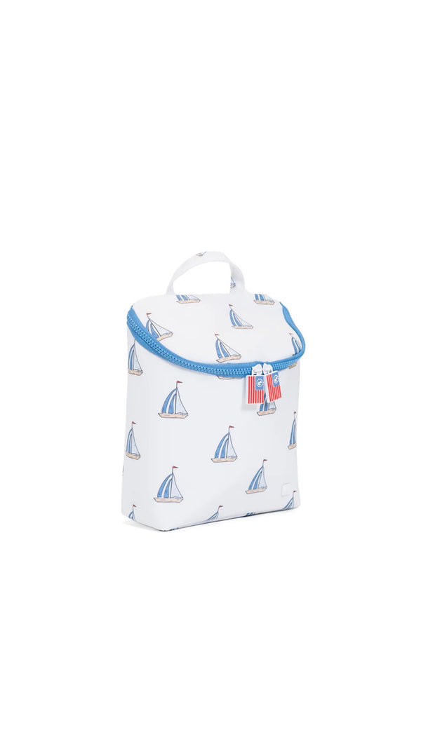White lunch bag with blue trim and sailboat pattern on a white background