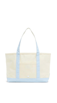 Beige tote bag with blue checkered trim on a white background