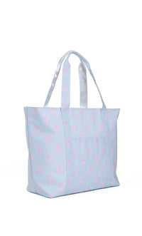 Light blue tote bag with pink bow  pattern on a white background