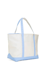 A large canvas tote bag with blue gingham trim on the handles and bottom, with a white background.