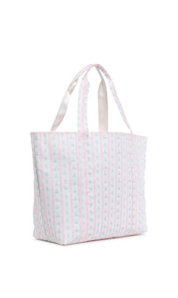 A pink floral jumbo tote bag with two handles, a front exterior pocket, and a striped pattern.