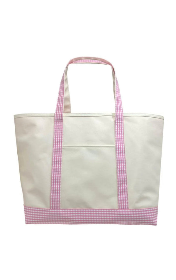 A large canvas tote bag with gingham pink trim and a white zipper.