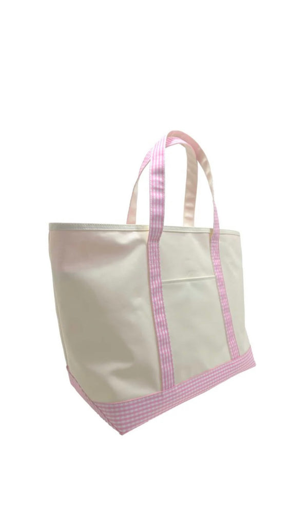 A large canvas tote bag with gingham pink trim and a white zipper.