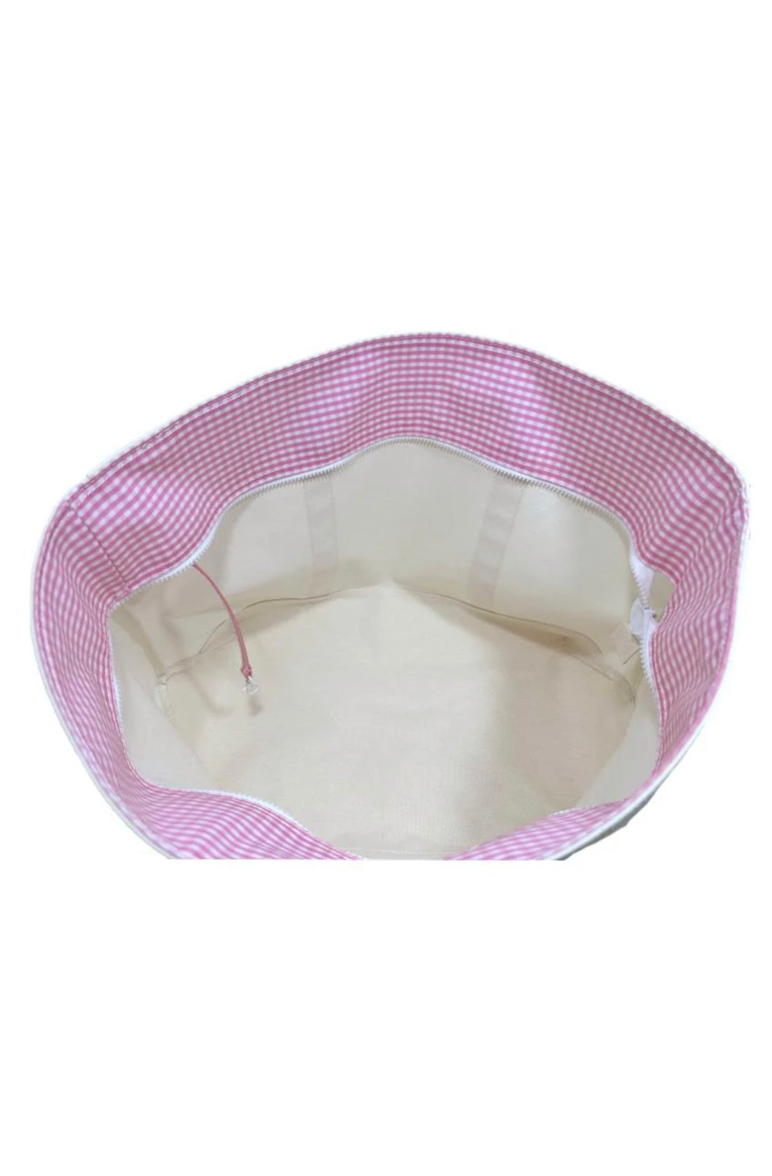 A large canvas tote bag with gingham pink trim and a white zipper.