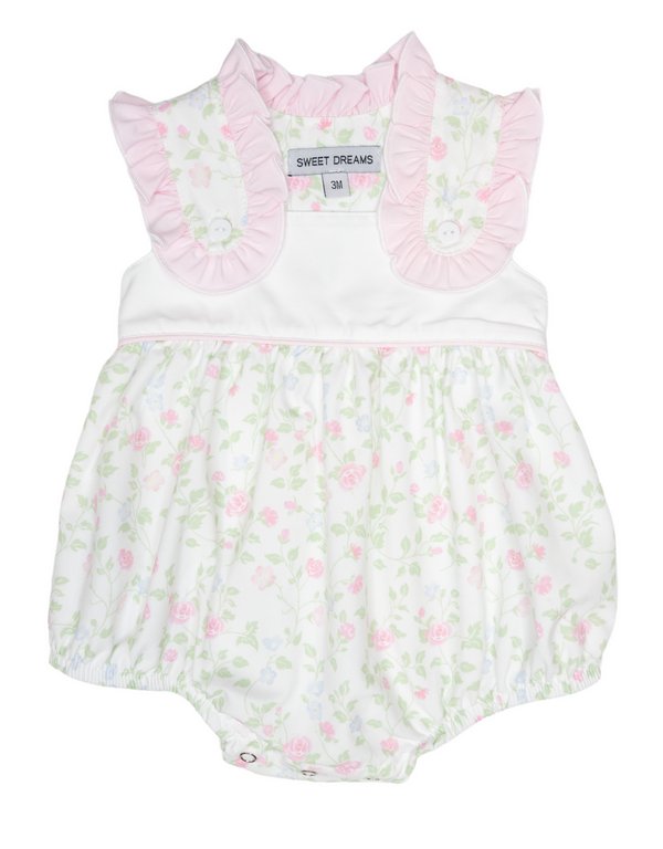 Baby romper with floral pattern and pink ruffled collar on a hanger.