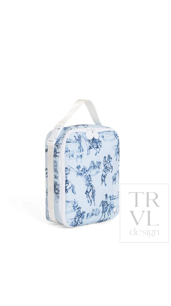 Light blue cowboy toile print TRVL Lunch Box bag with white top handle, side view showing zip closure