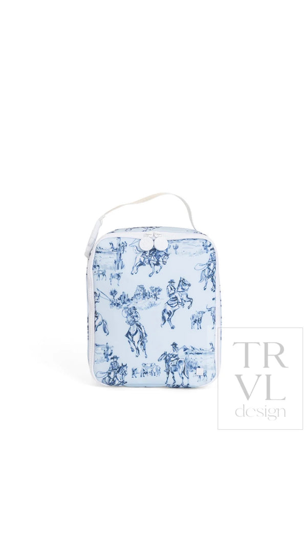 Light blue cowboy toile print TRVL Lunch Box bag with white top handle and snap closure, front view