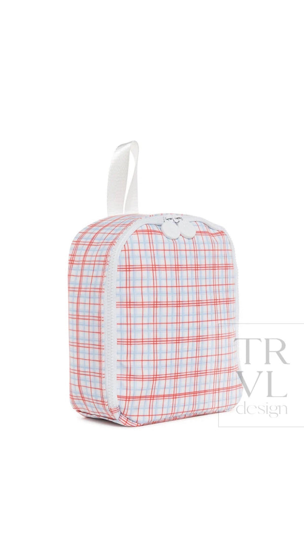 Red, white, and blue plaid TRVL Bring It lunch bag with white top handle, side view showing zipper