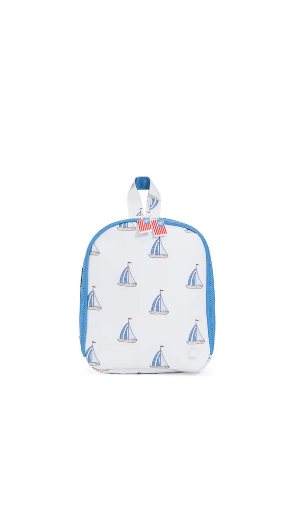 Small lunchbox with sailboat pattern on a white background
