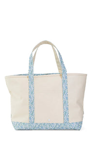 Beige tote bag with floral trim on a white background