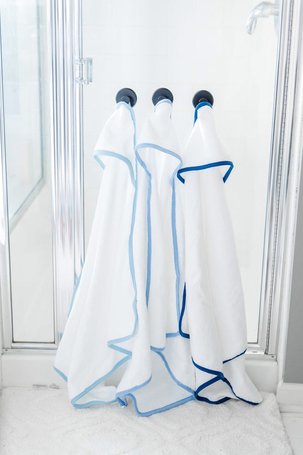 Hooded towel for baby, available in blue and pink gingham