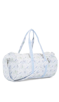 White duffel bag with blue golf pattern and straps on a white background