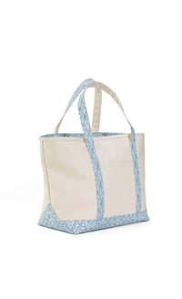 Tote bag with floral edge design on a white background