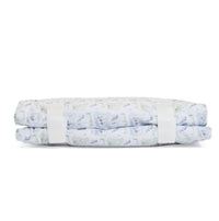 Folded nap mat with golf pattern on a white background