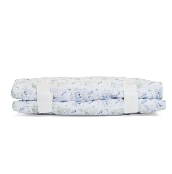Folded nap mat with golf pattern on a white background