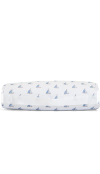 Folded nap mat with sailboat pattern on a white background