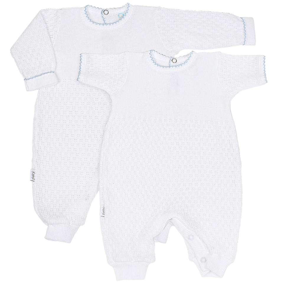 Two white baby rompers with blue trim on a white background