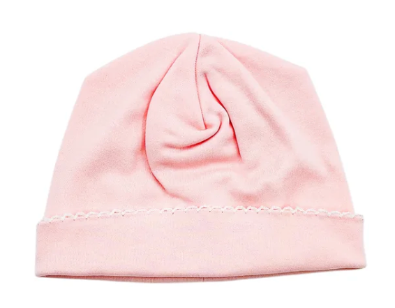 A light pink knit beanie hat with a folded cuff, shown against a plain white background.