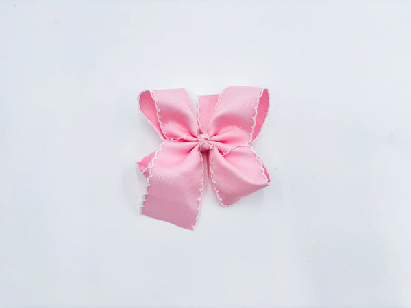 Pink bow with white trim for baby