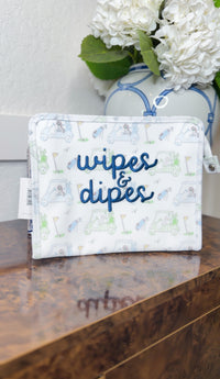 White TRVL pouch with blue golf cart print, embroidered 'wipes & dipes' in navy cursive