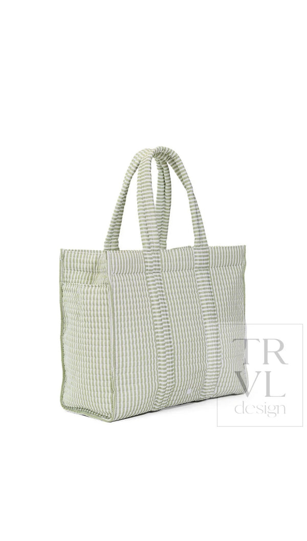 Sage green and white quilted Pimlico stripe TRVL Go Go Tote, side angle view showing exterior pocket