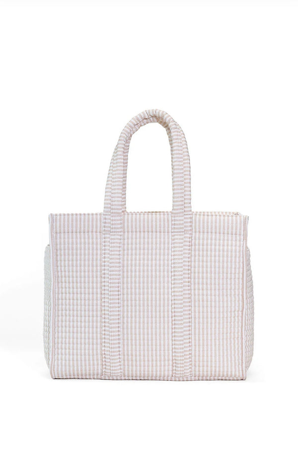 White and sand quilted tote on a white background