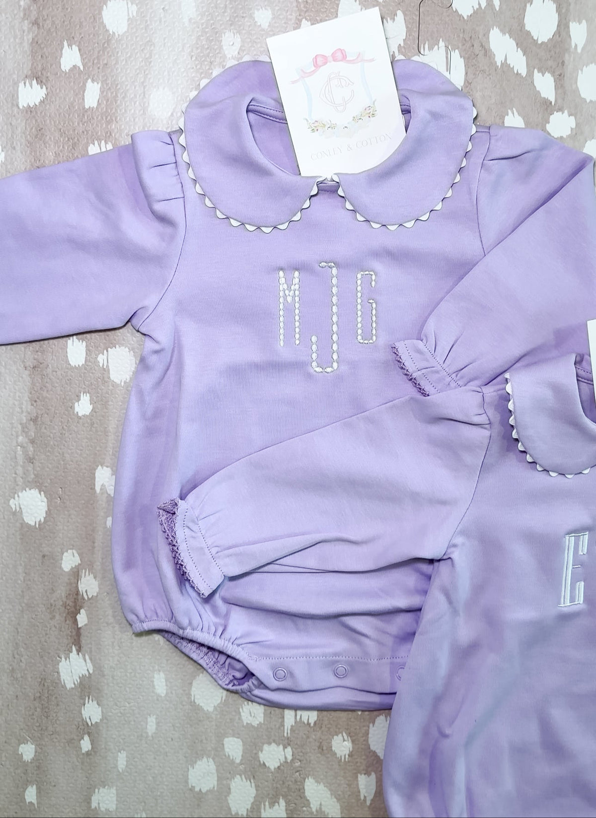 Lavender scalloped long sleeve bubble romper for baby