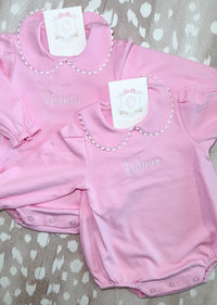 Pink scalloped long sleeve bubble romper for baby, ready for monogramming