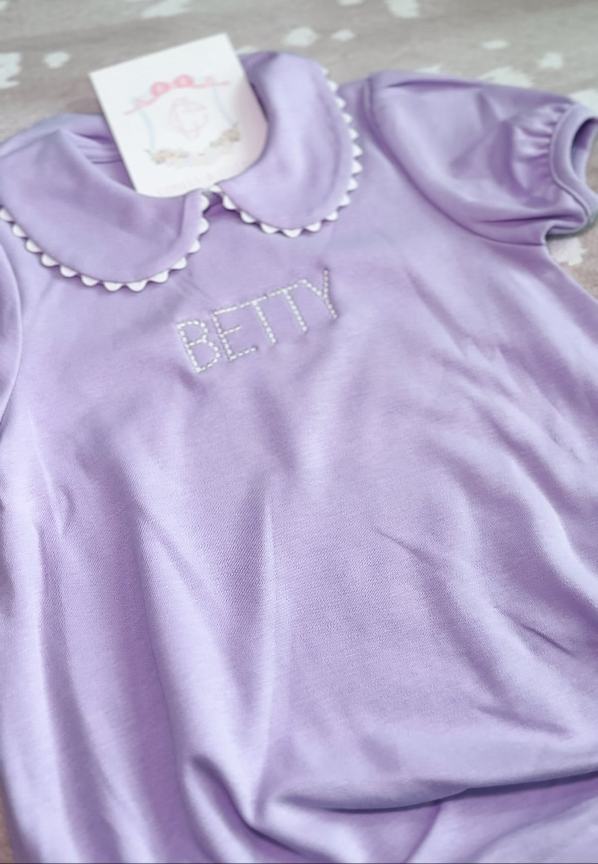 Lavender short sleeve scalloped collared bubble romper for baby, ready for monogramming