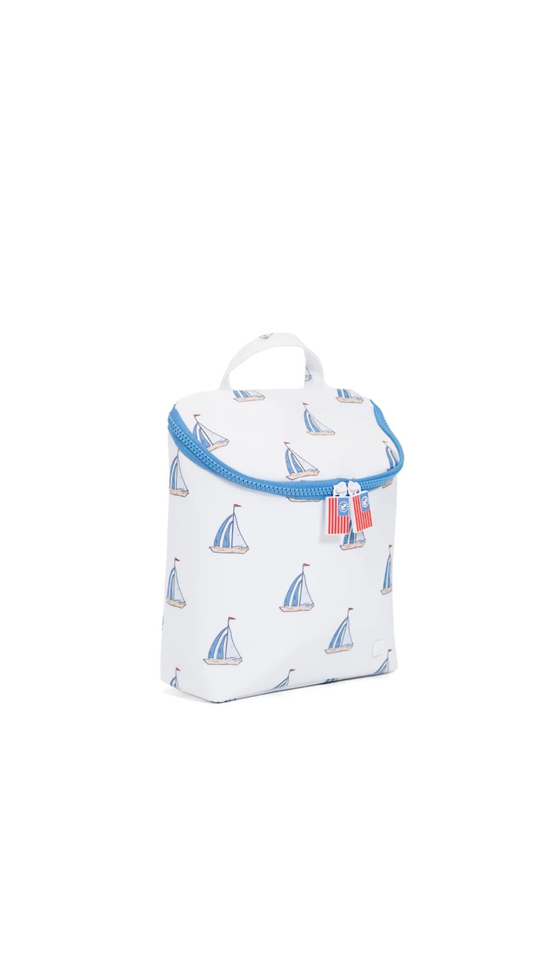 White lunch bag with blue trim and sailboat pattern on a white background