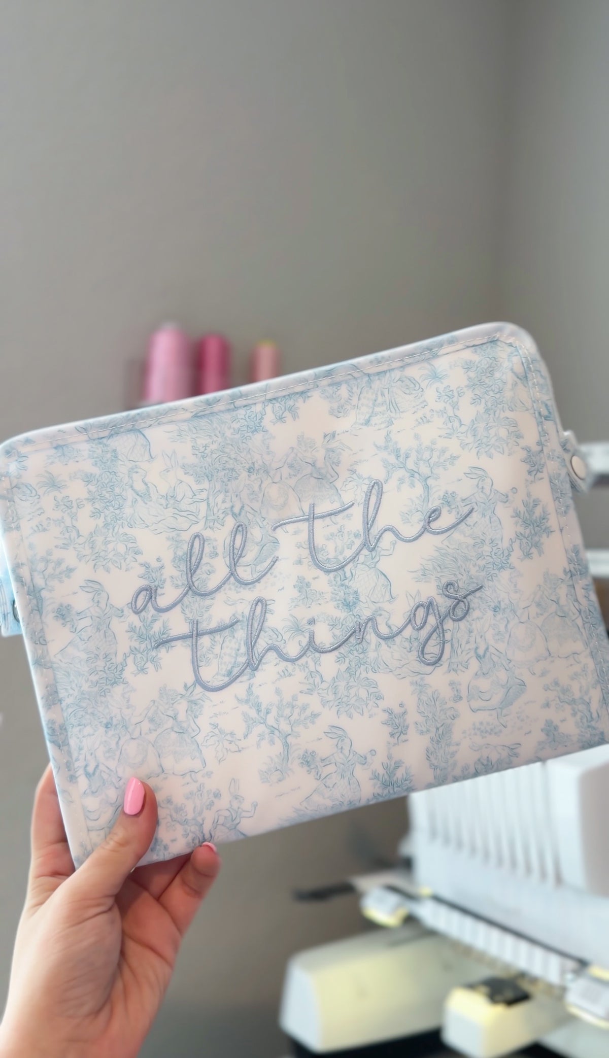 Blue bunny toile TRVL pouch embroidered 'all the things' in blue script