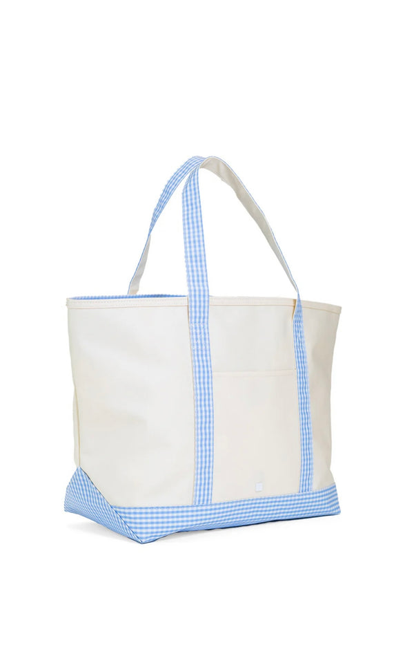 A large canvas tote bag with blue gingham trim on the handles and bottom, with a white background.